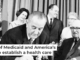 President Lyndon B. Johnson, left, next to former President Harry S. Truman, signs into law the measure creating Medicare and Medicaid in 1965. AP Photo